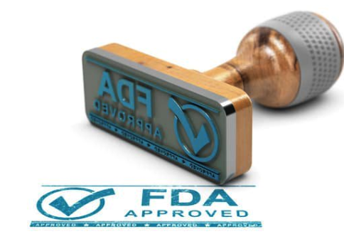 3D illustration of an FDA approved rubber stamp with a checkmark and 'FDA Approved' text.